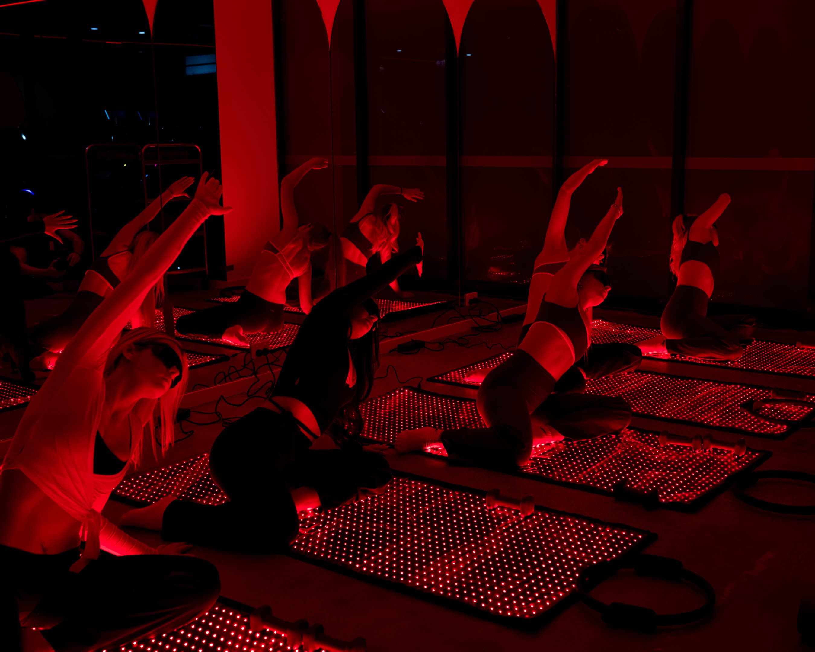 Group red light Pilates class at ARC